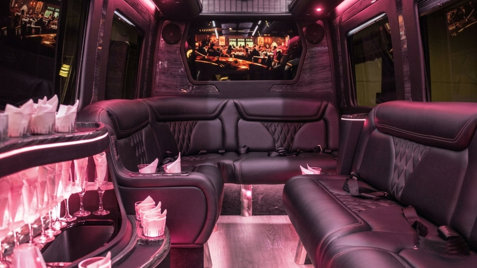 Party bus interior - wraparound lounge seating and LED party lighting